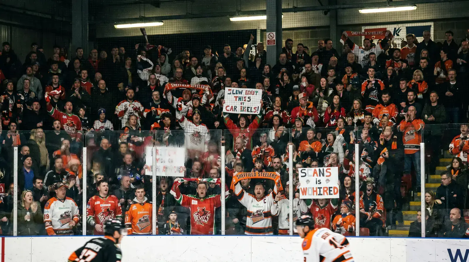 Loud EIHL arena crowd creating atmosphere during a home team game