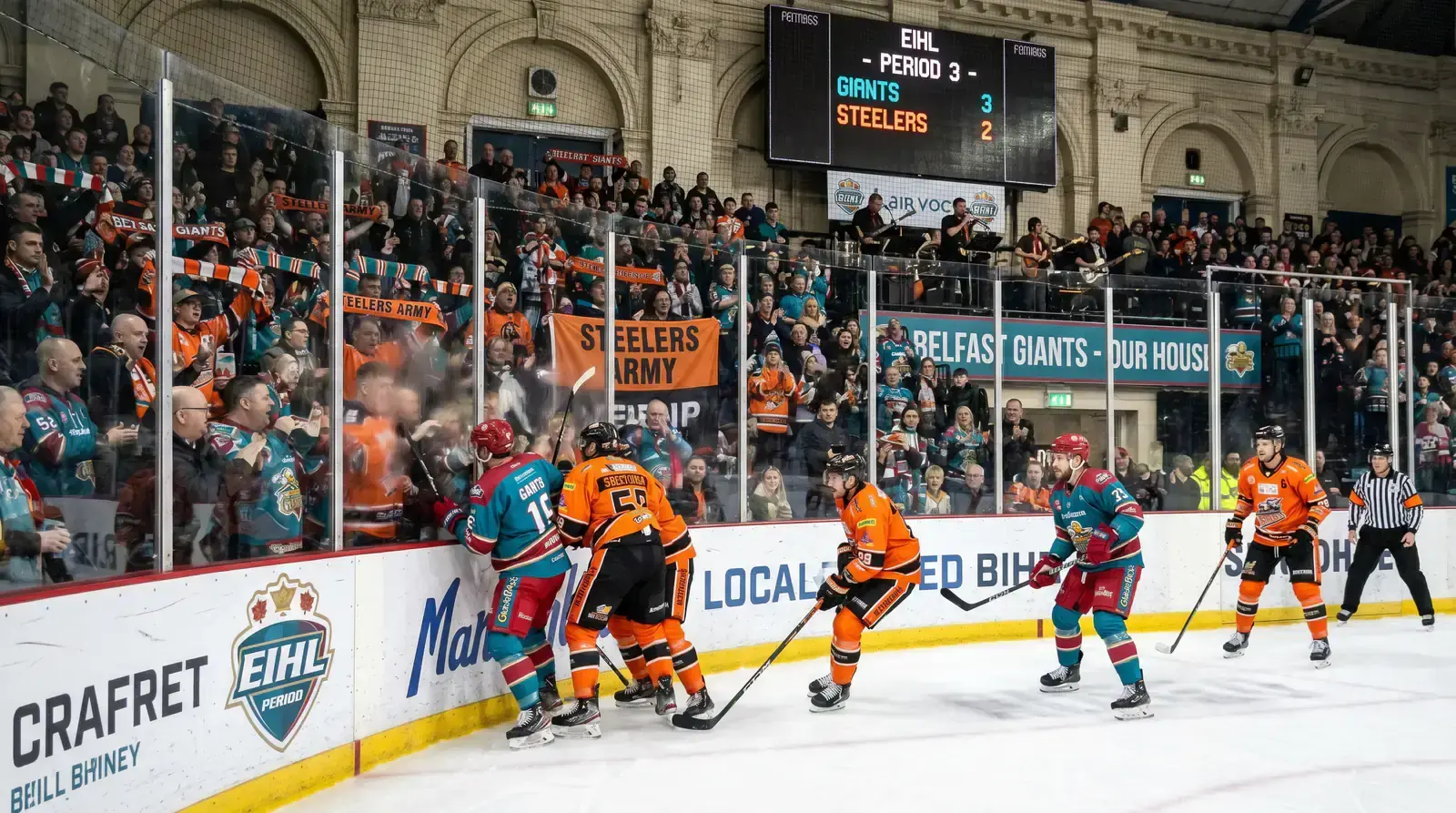 British EIHL ice hockey game in action at a packed arena with enthusiastic fans