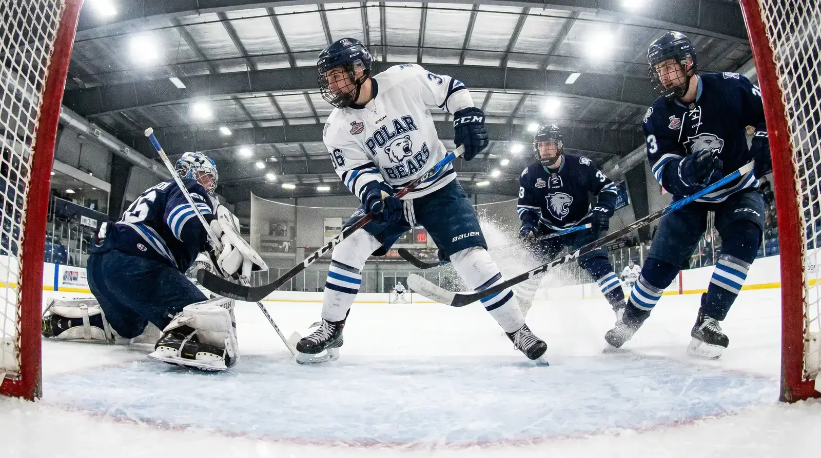 Hockey players during a defensive zone breakdown allowing a scoring chance