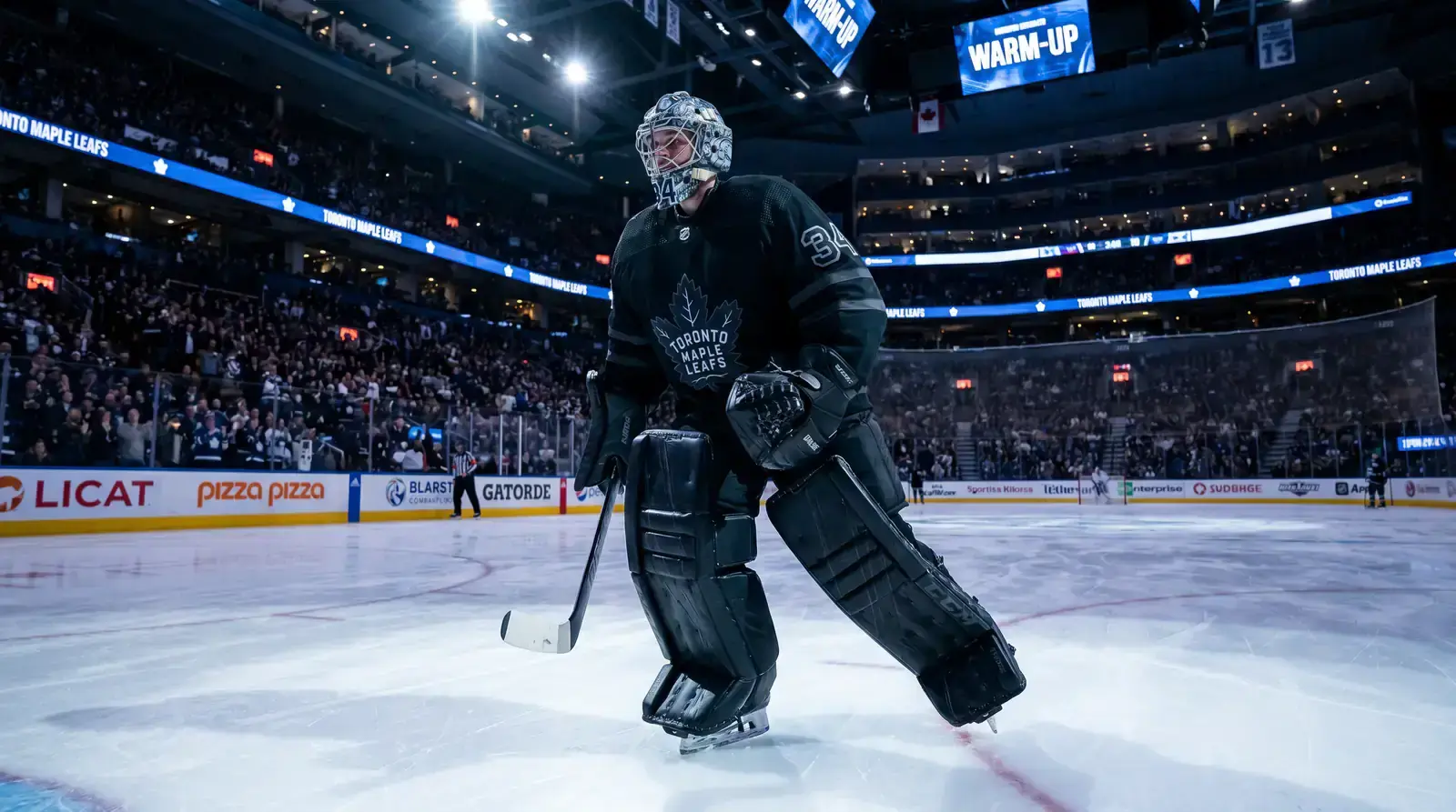 NHL starting goaltender in full equipment skating onto the ice before a game