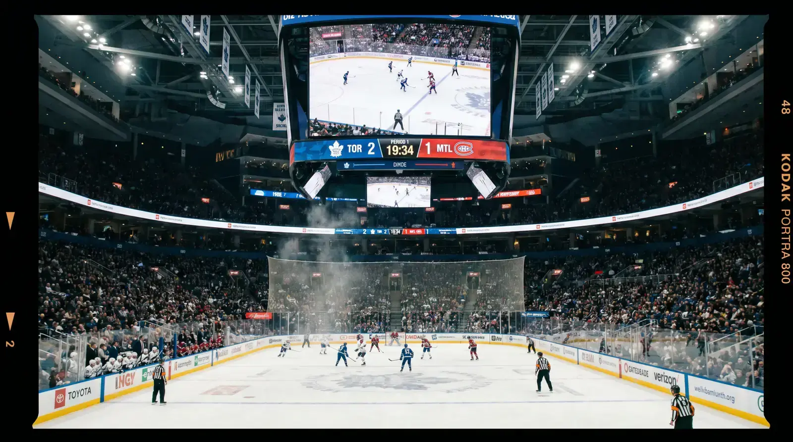 Hockey arena clock and scoreboard displaying first period time during an NHL game