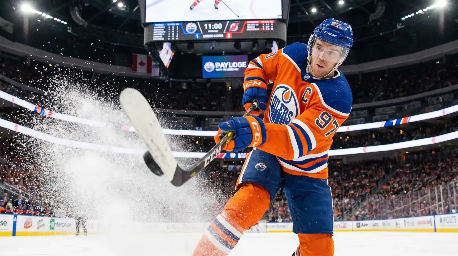 NHL star forward in action taking a shot during a regular season game