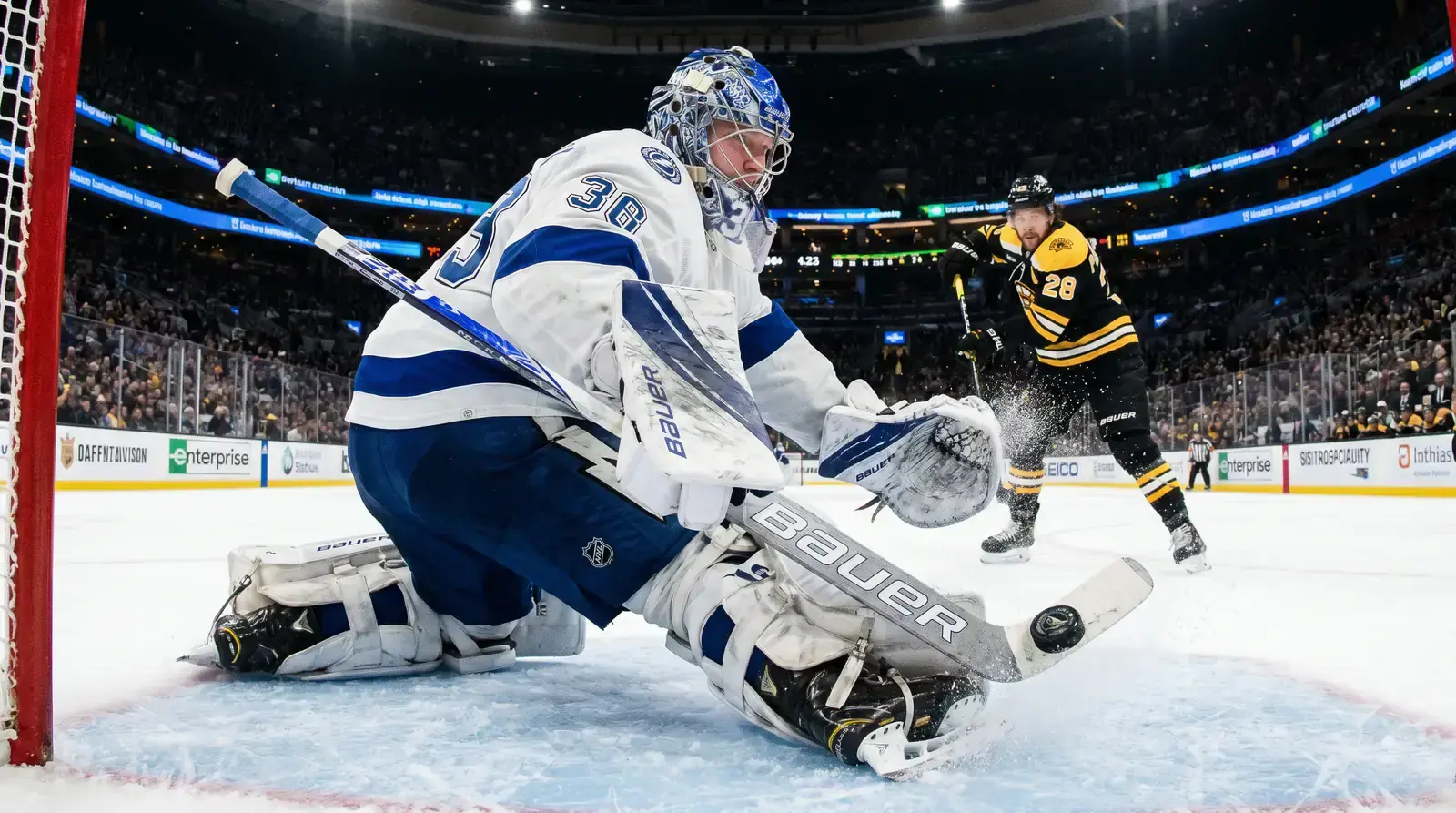 Ice hockey goaltender making a save during an NHL game